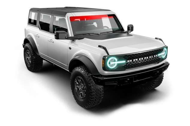 A blue tesla model s is on a black background.