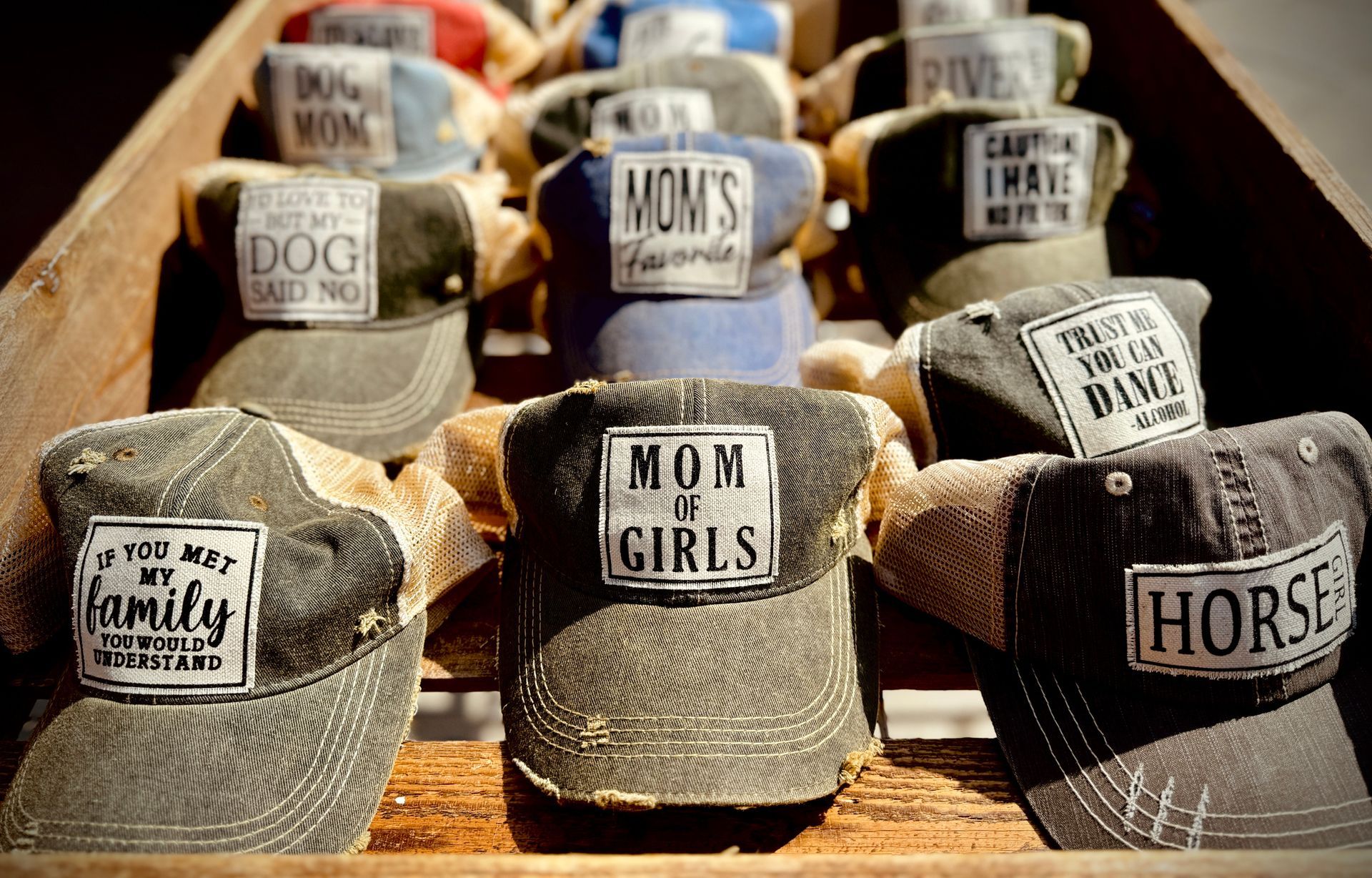 Trucker hats with embroidered phrases: