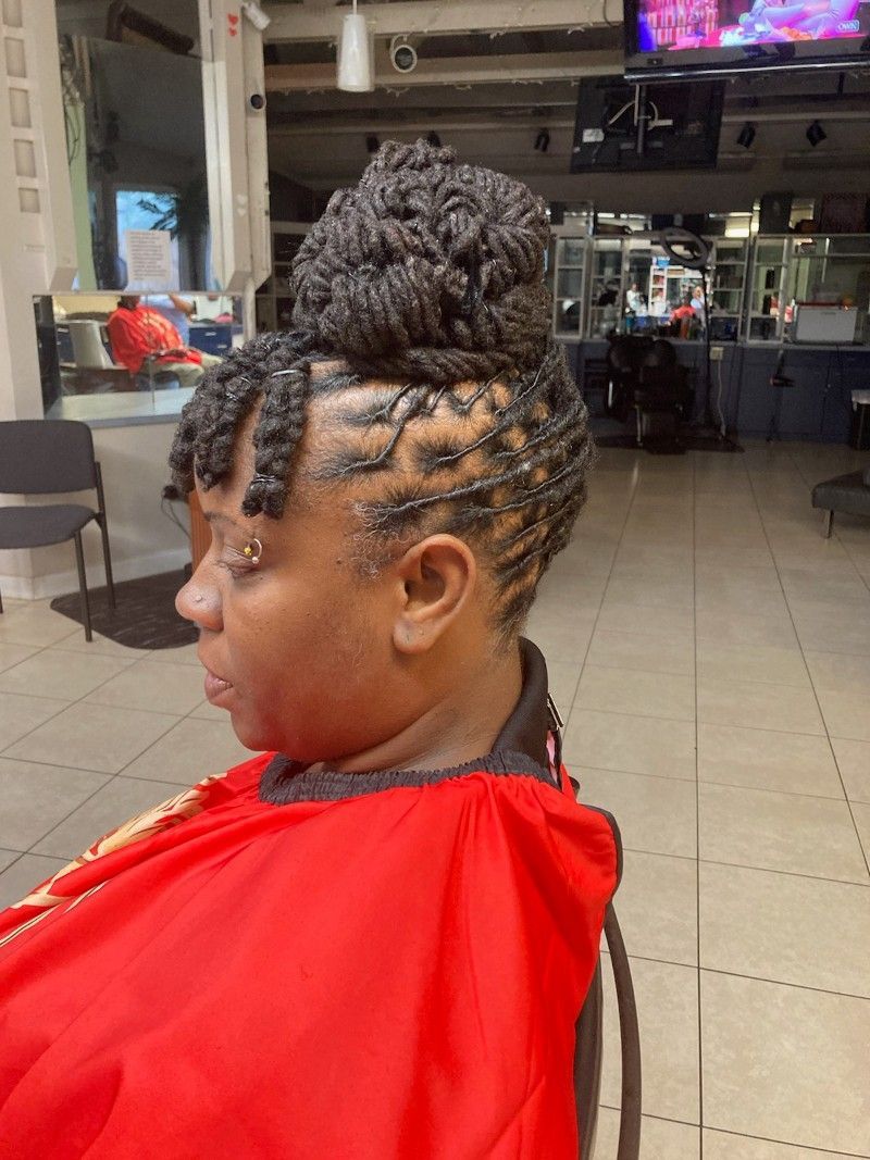 A woman is getting her hair done in a salon.