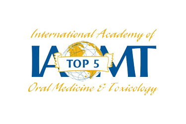 Logo for the International Academy of Oral Medicine & Toxicology. Features "IAOMT" in blue, a globe, and "Top 5" on a banner.