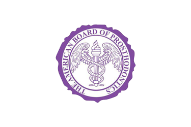 The American Board of Prosthodontics seal is purple. It contains a caduceus with wings, a flame, and the organization's name in a circle.