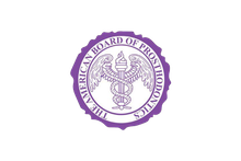 The American Board of Prosthodontics seal is purple. It contains a caduceus with wings, a flame, and the organization's name in a circle.
