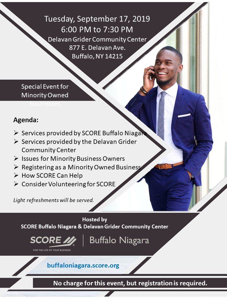 A man in a suit and tie is talking on a cell phone.