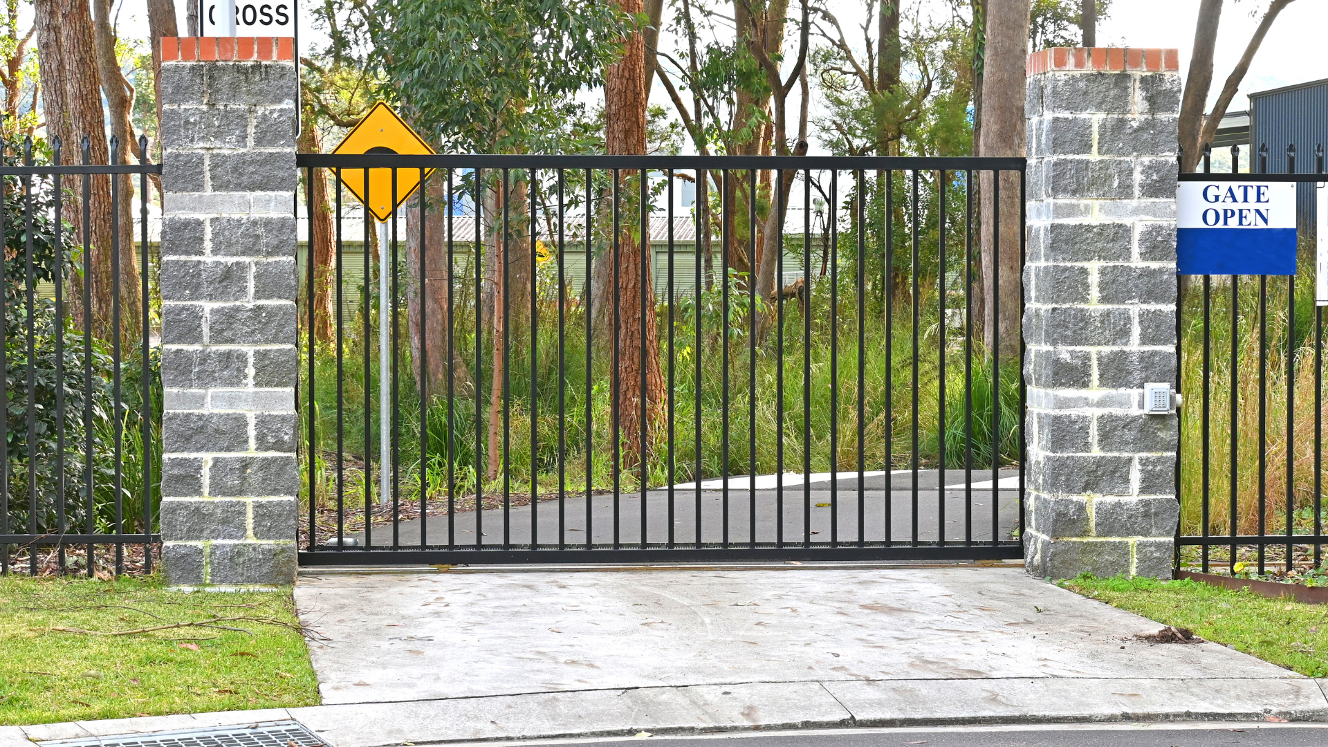 A gate with a sign that says lock open on it