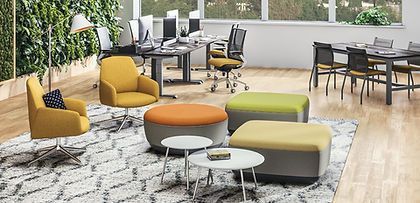 A living room filled with furniture , tables , chairs and ottomans.