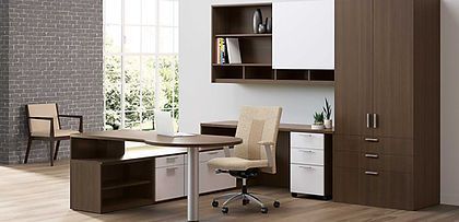 There is a desk with a chair in the middle of the room.