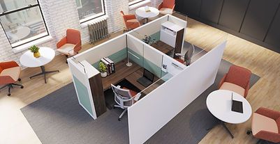 An aerial view of a cubicle in an office with tables and chairs.