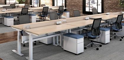 A large office with a lot of desks and chairs.