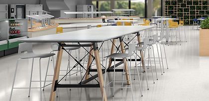 There are a lot of tables and chairs in this room.