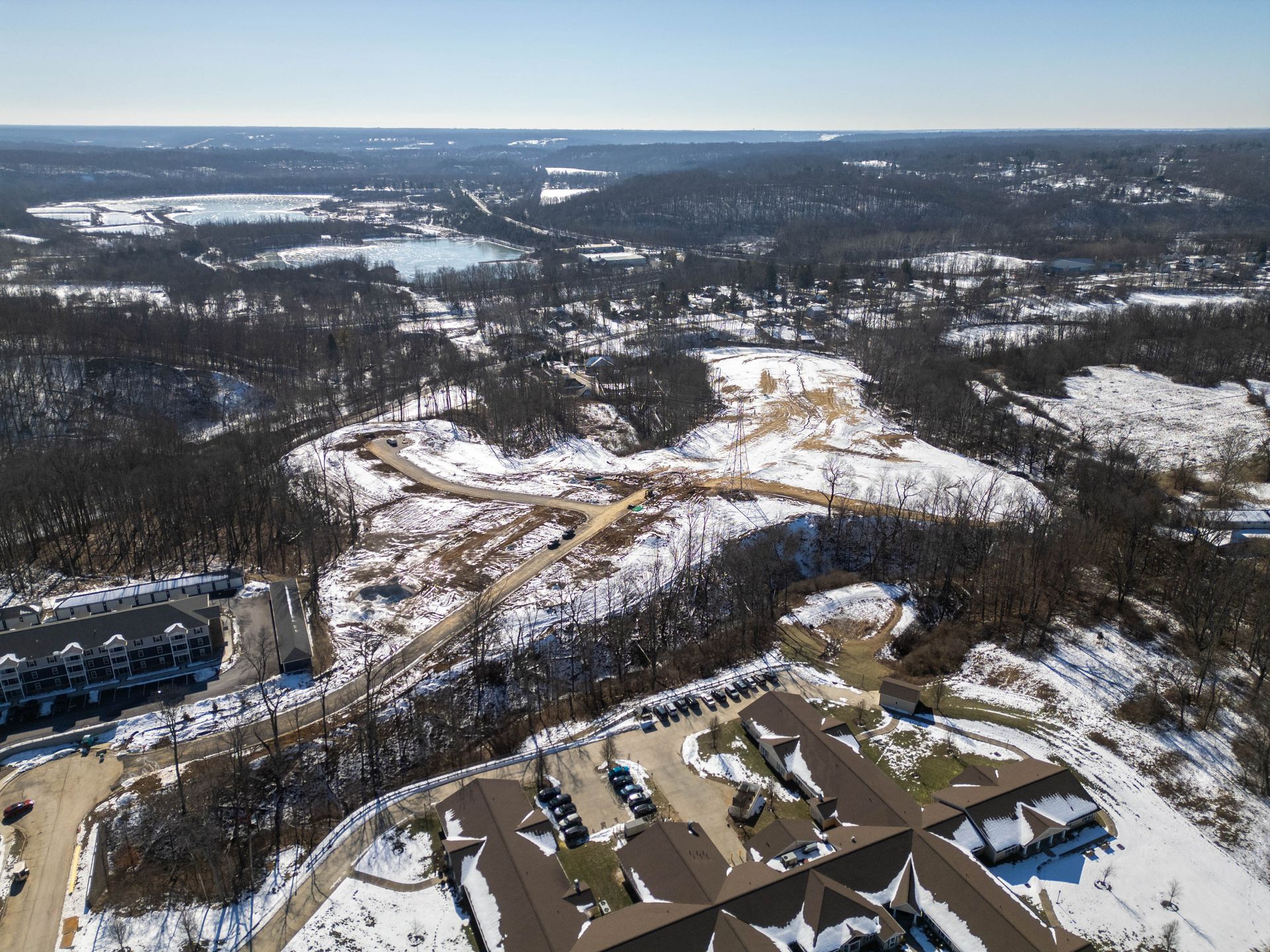 An aerial view of a residential area covered in snow.