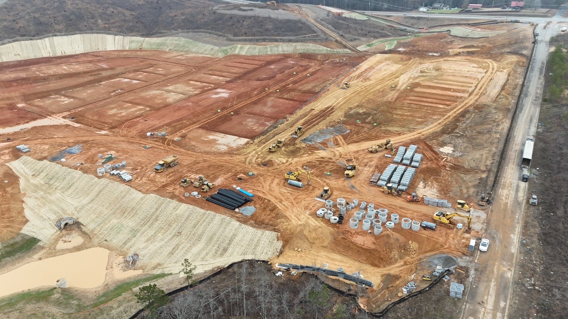 An aerial view of a large construction site with a lot of machinery.