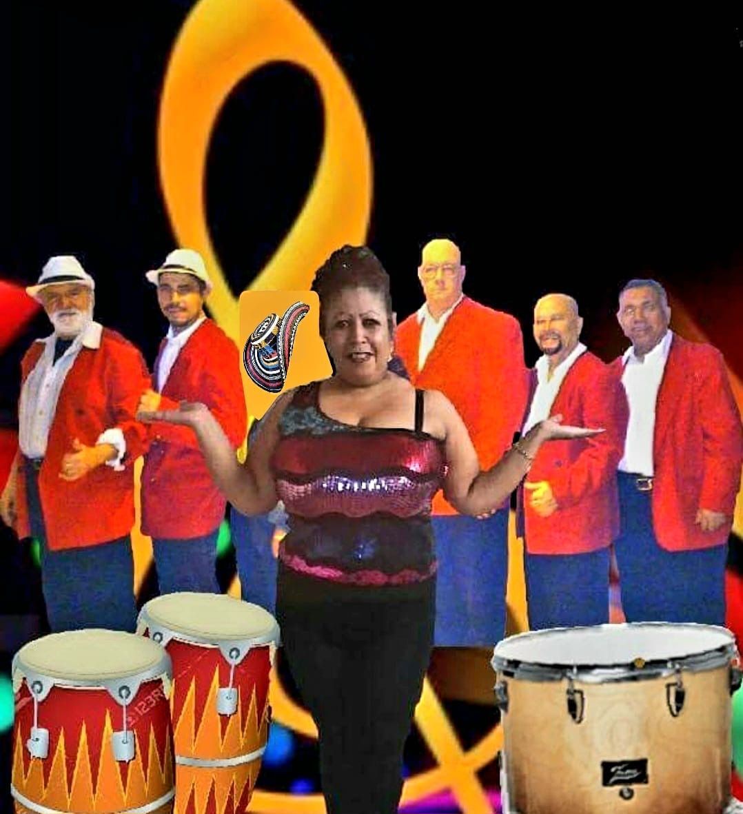 A woman stands in front of a group of men and drums