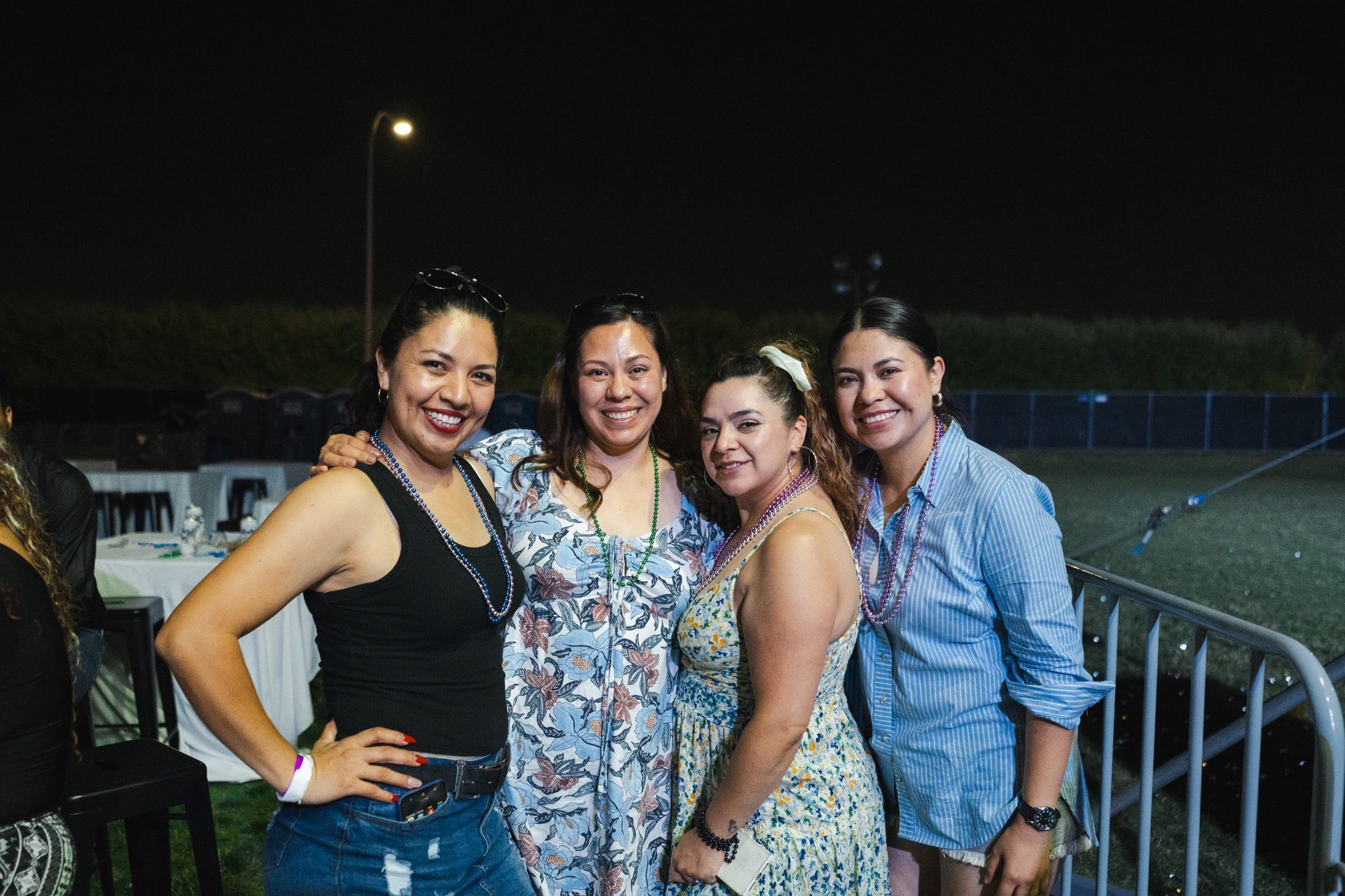 A group of women are posing for a picture together.