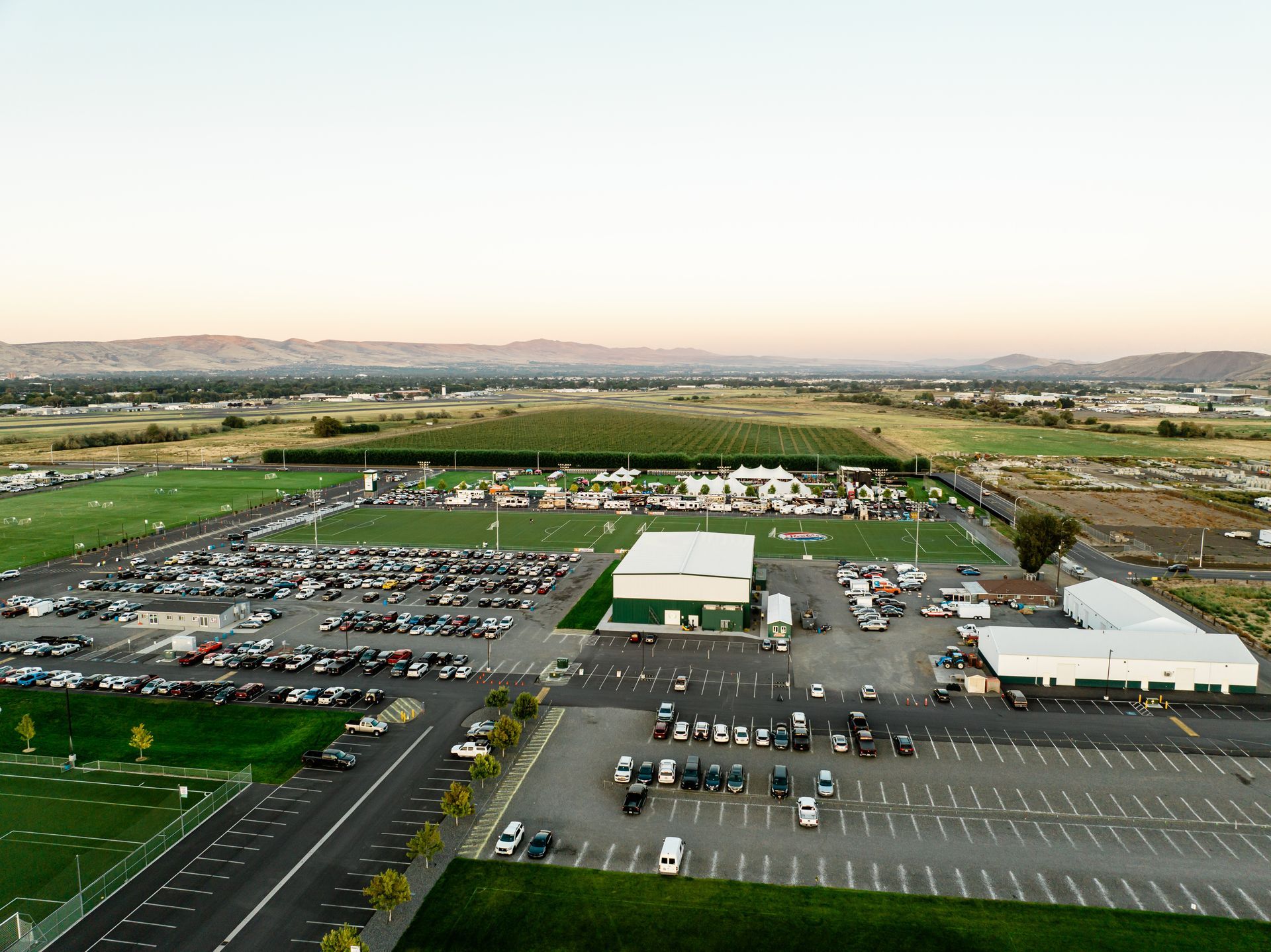 An aerial view of Sozo parking lot with a lot of cars parked in it