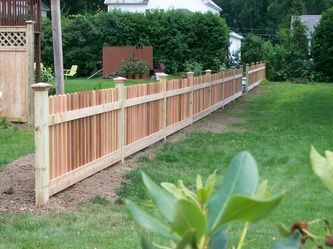 A Wooden Fence in the Middle of a Yard – Pittsfield, MA - New England Fence