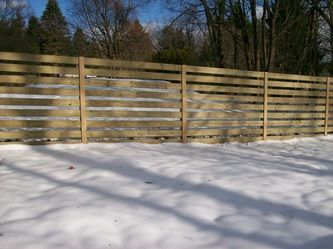 A Wooden Fence is Surrounded by Snow – Pittsfield, MA - New England Fence