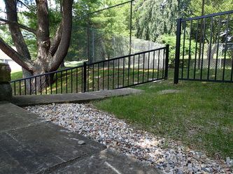 A Black Metal Fence in the Background – Pittsfield, MA - New England Fence