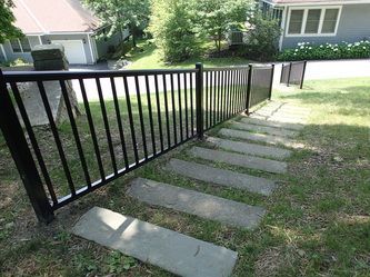 Metal Fence Besides a Concrete Walkway – Pittsfield, MA - New England Fence