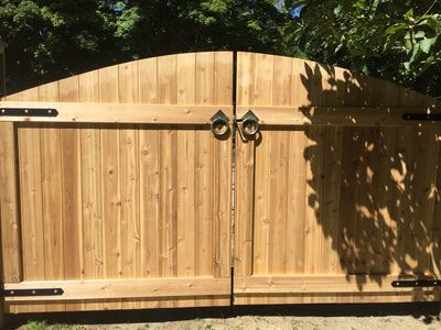 A Wooden Gate With a Curved Top – Pittsfield, MA - New England Fence