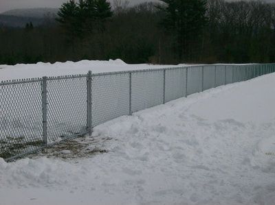 A Chain Link Fence With Snow – Pittsfield, MA - New England Fence