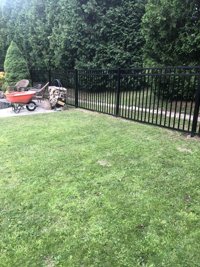 Metal Fence on a Green Lawn – Pittsfield, MA - New England Fence