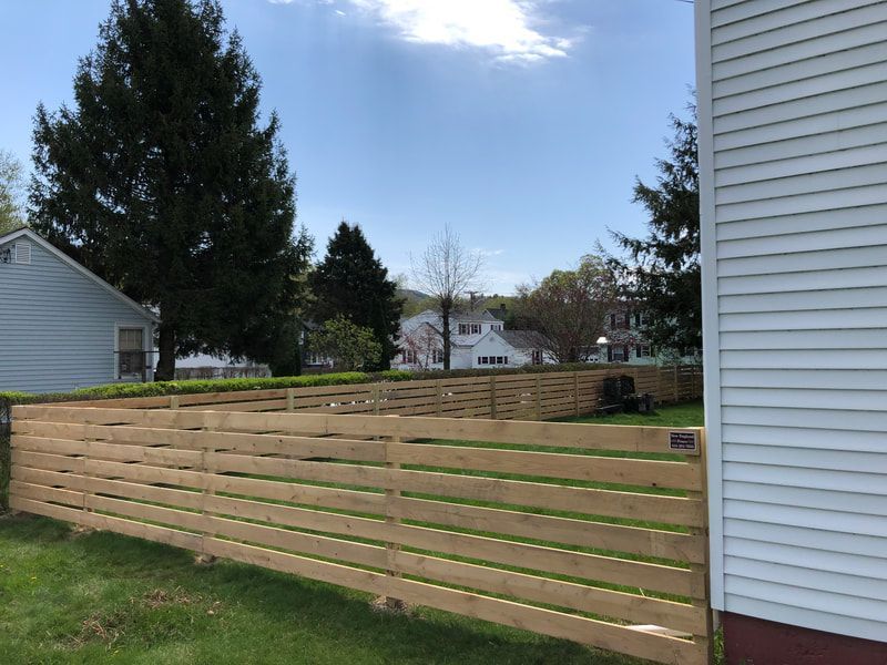 Wooden Fence in the Backyard – Pittsfield, MA - New England Fence