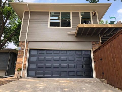 Residential Garage Door - A Low Angle View Of Closed Steel Garage Doors in Dallas/Fort Worth, TX