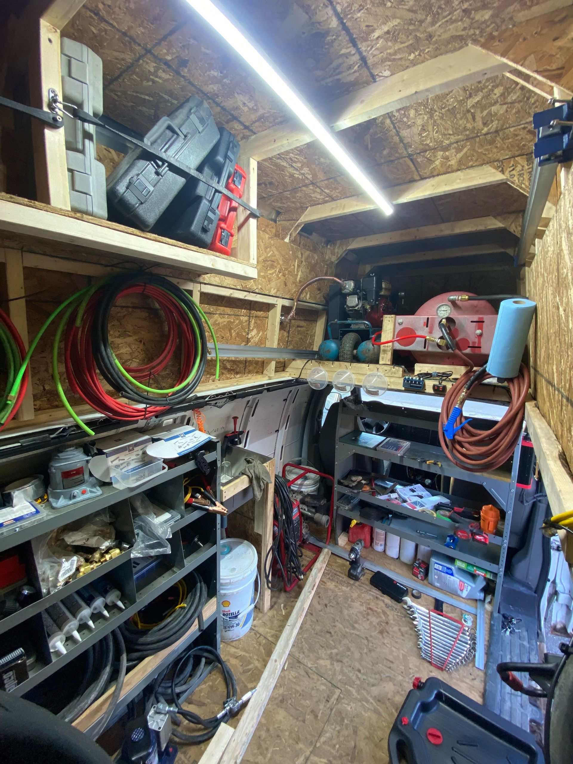 A garage filled with lots of tools and equipment.