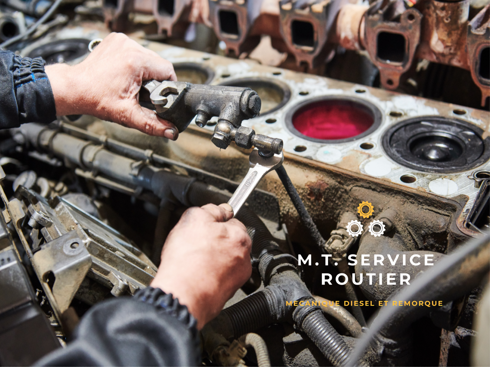 A man is working on a car engine with a wrench.