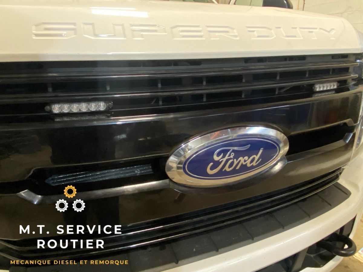 The front of a ford super duty truck is shown.