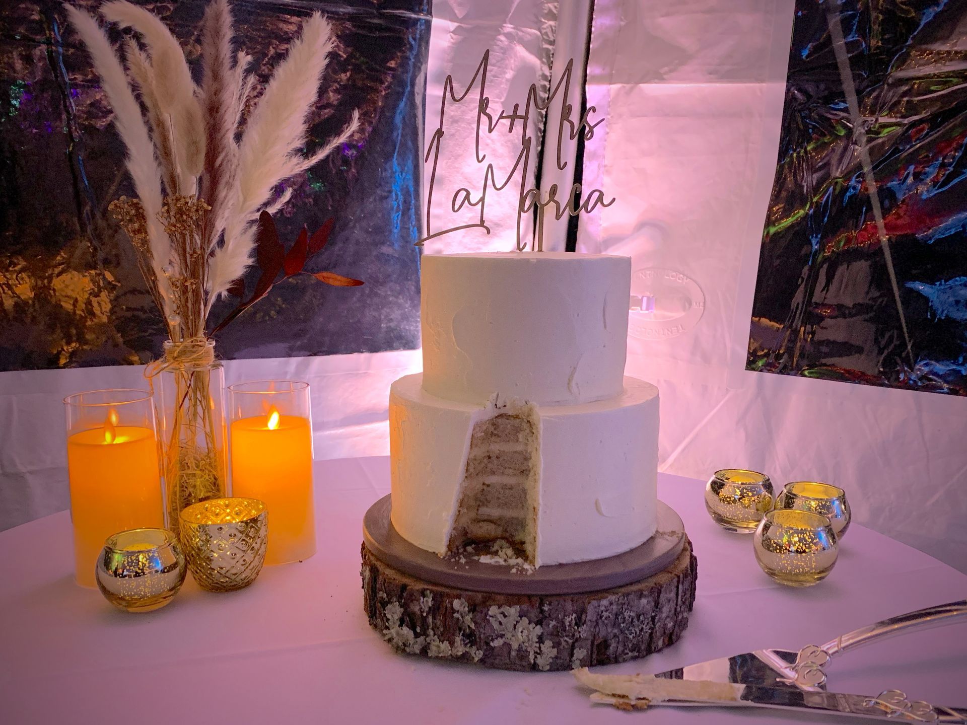 Mix It Up! custom wedding cakes 2 tier white frosting with a piece cut to show the layers inside