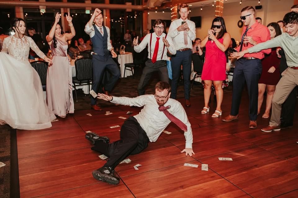 Mix It Up! providing dj services to a wedding where a man is on the floor dancing