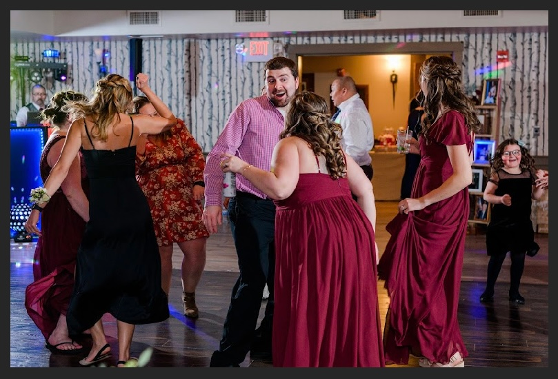 Mix It Up! providing dj services to a wedding where many people are dancing