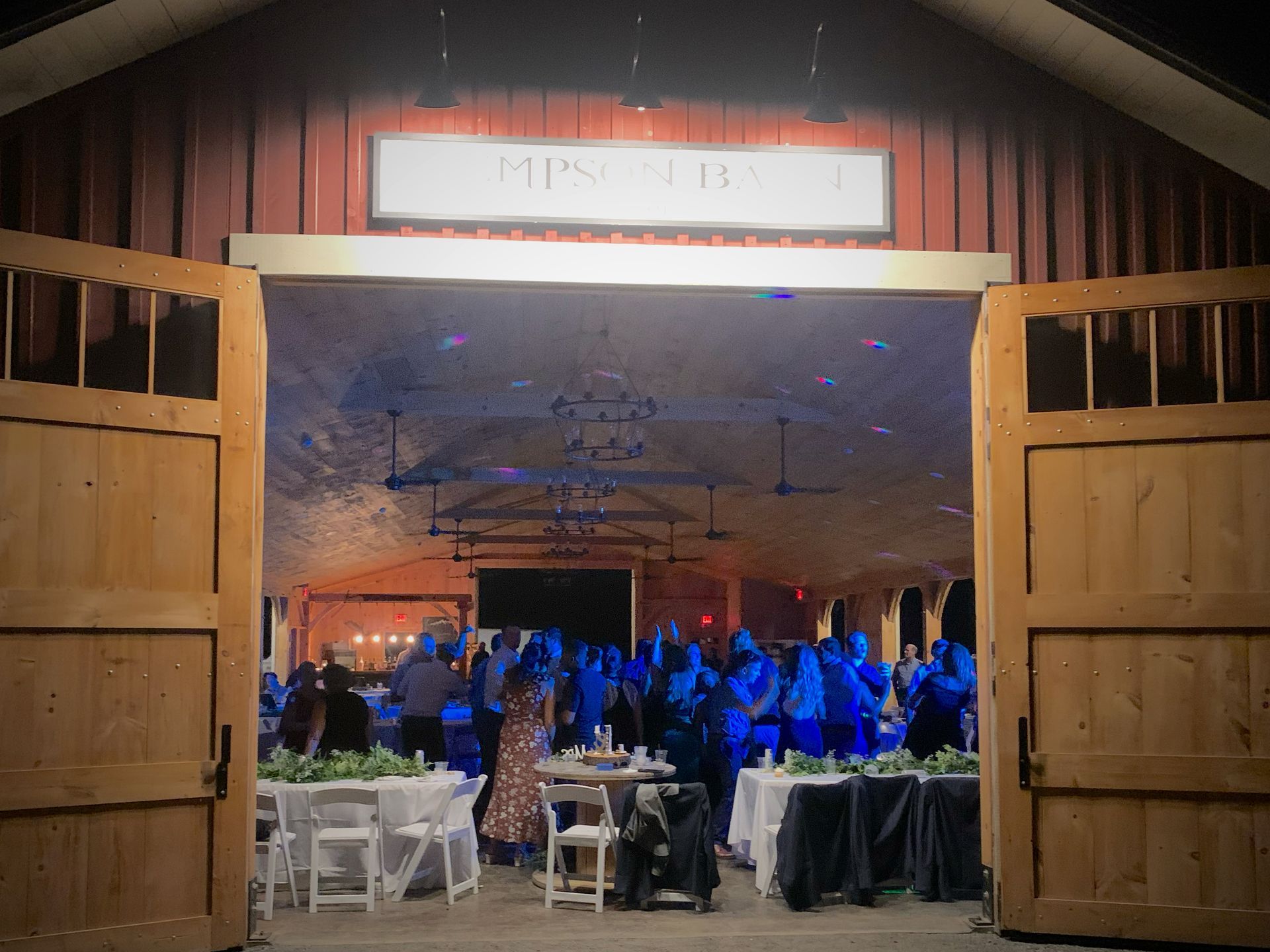 Mix It Up! providing dj services while a large group of people are dancing.