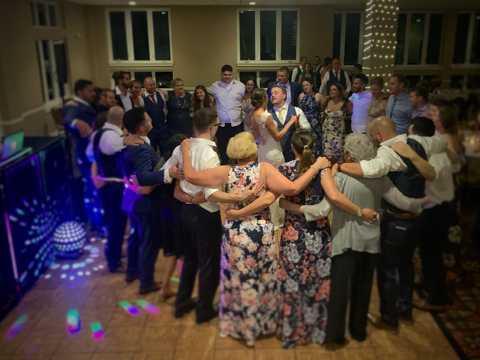 Mix It Up! providing dj services while a large group of people are dancing