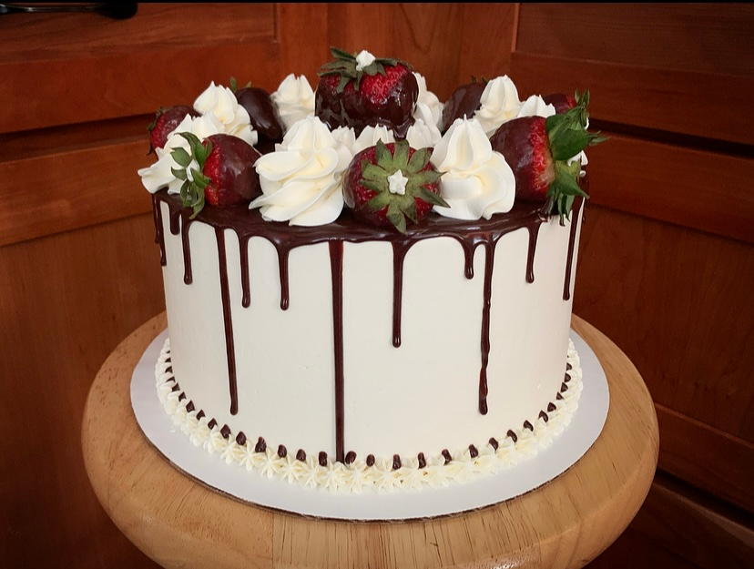 Mix It Up! cakes and cupcakes: White frosted cake with chocolate dipped strawberries for decoration