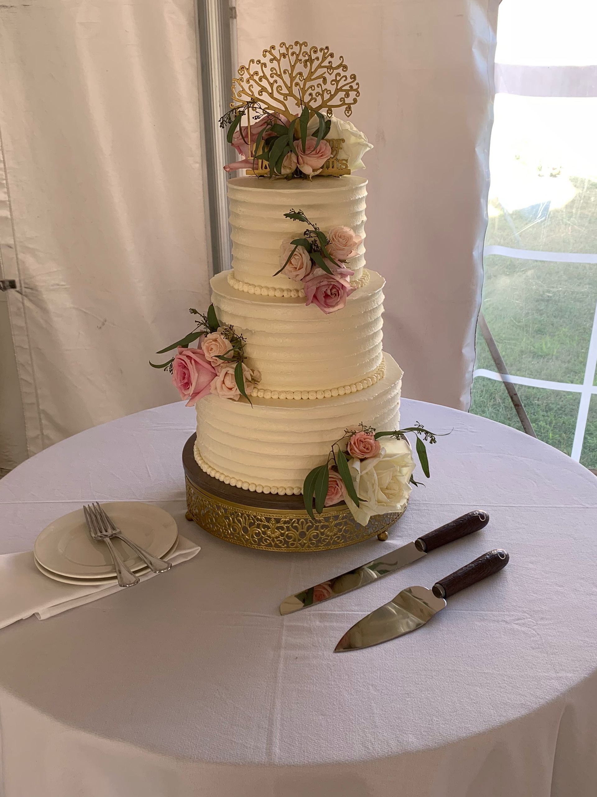 Mix It Up! custom wedding cakes 3 tier cake with white frosting with pink flowers