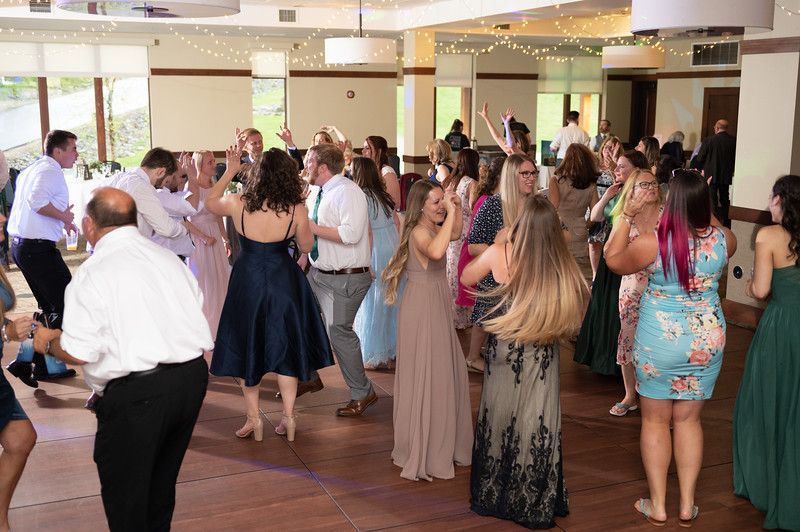 Mix It Up! providing dj services while a large group of people are dancing