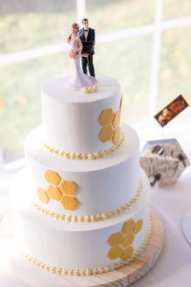 Mix It Up! custom wedding cakes 3 tier cake with white and yellow frosting with yellow hexagon shapes placed about