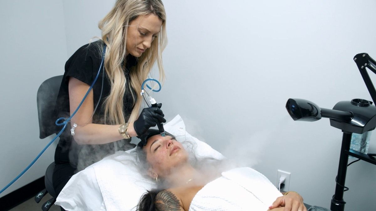 A woman is getting a hydrafacial treatment Huntington Beach