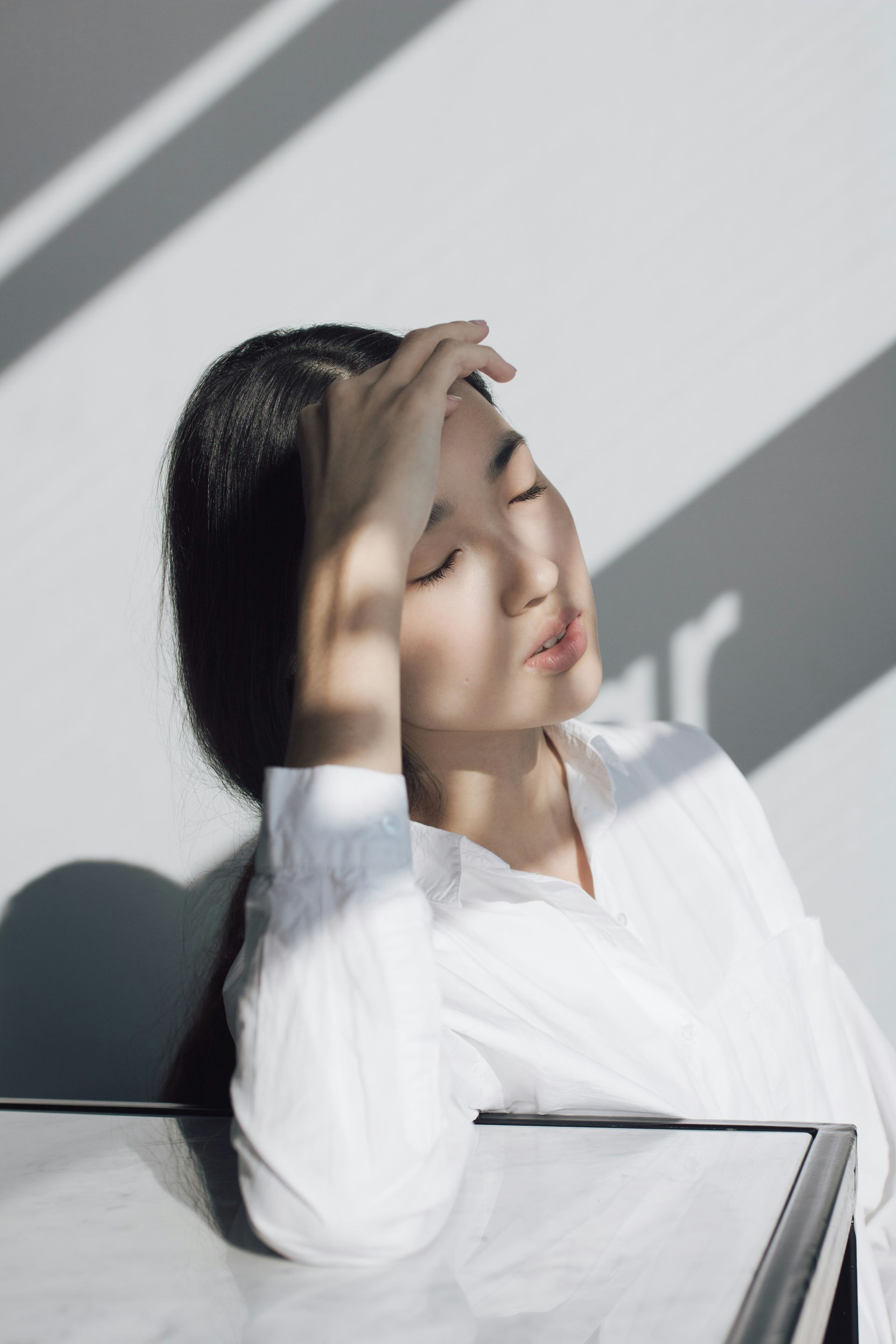 A woman is getting a laser treatment on her face.