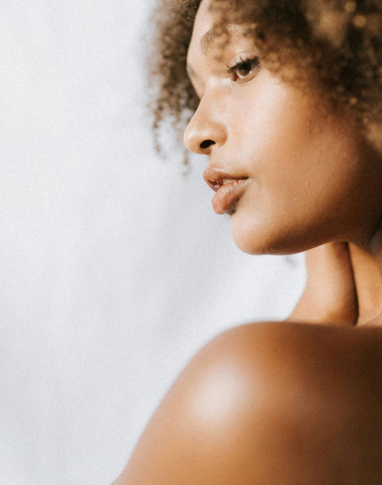 man looking in a mirror and smiling