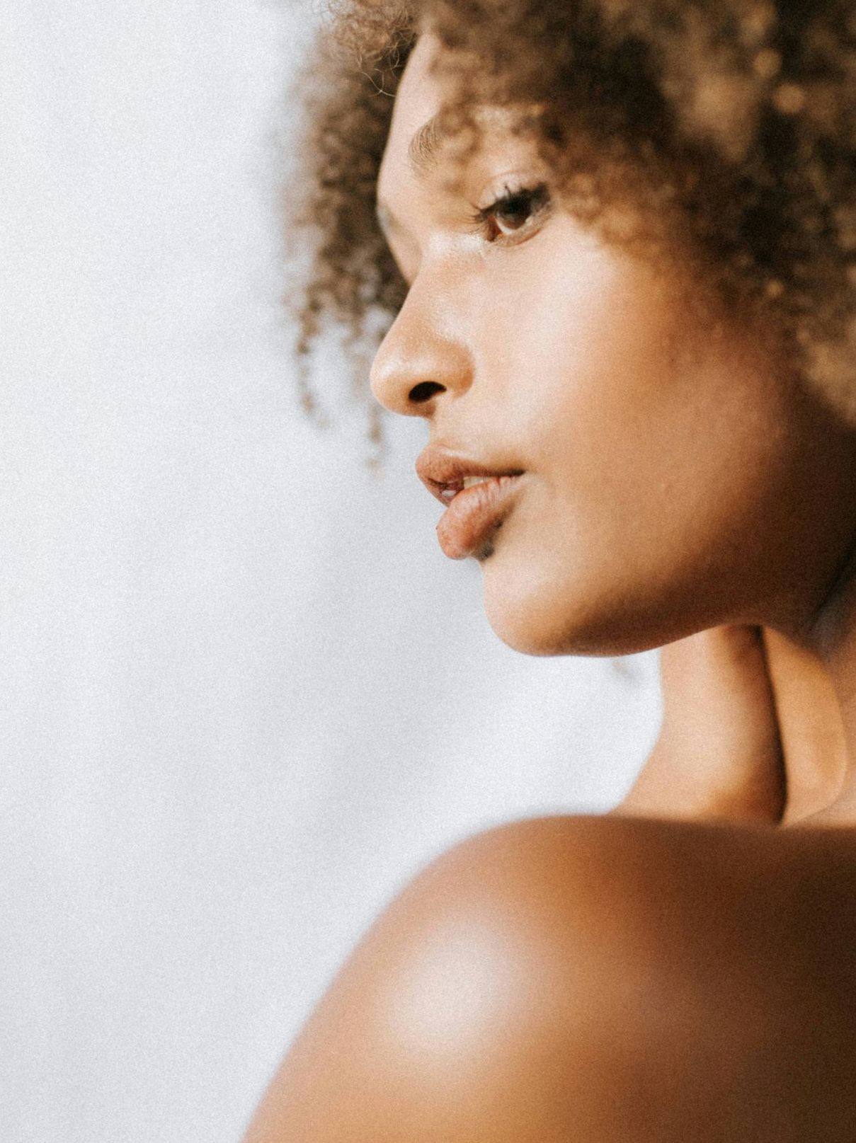 man looking in a mirror and smiling