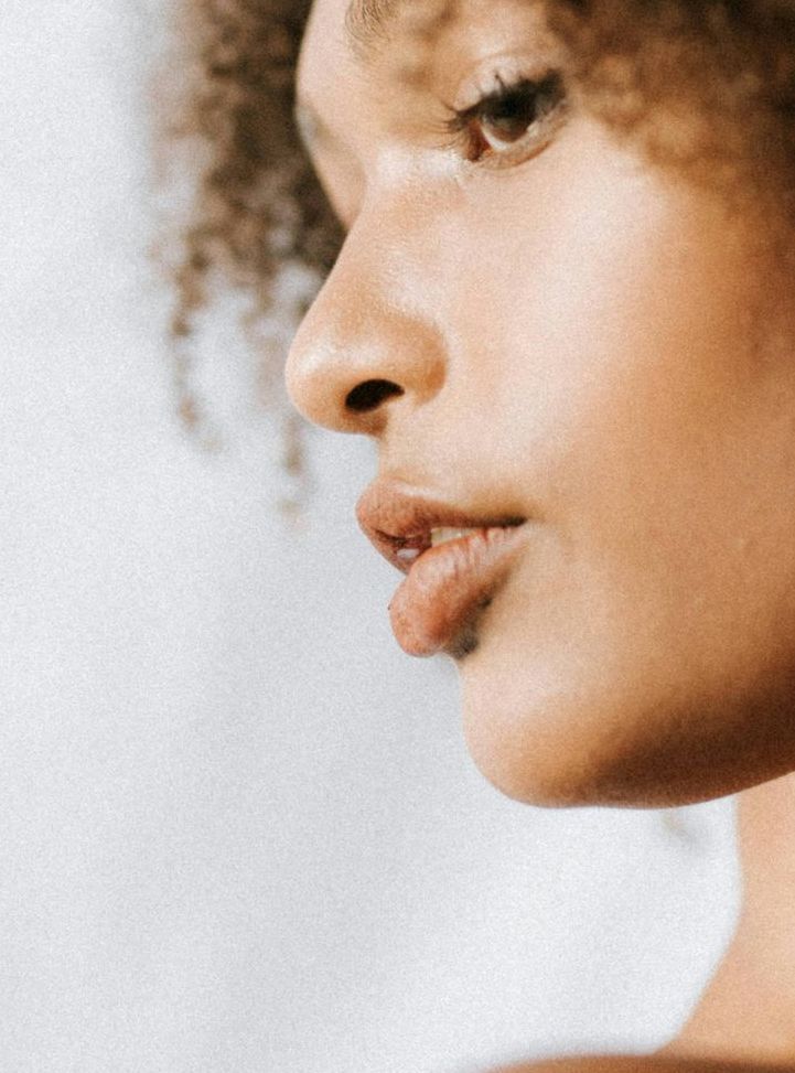 man looking in a mirror and smiling