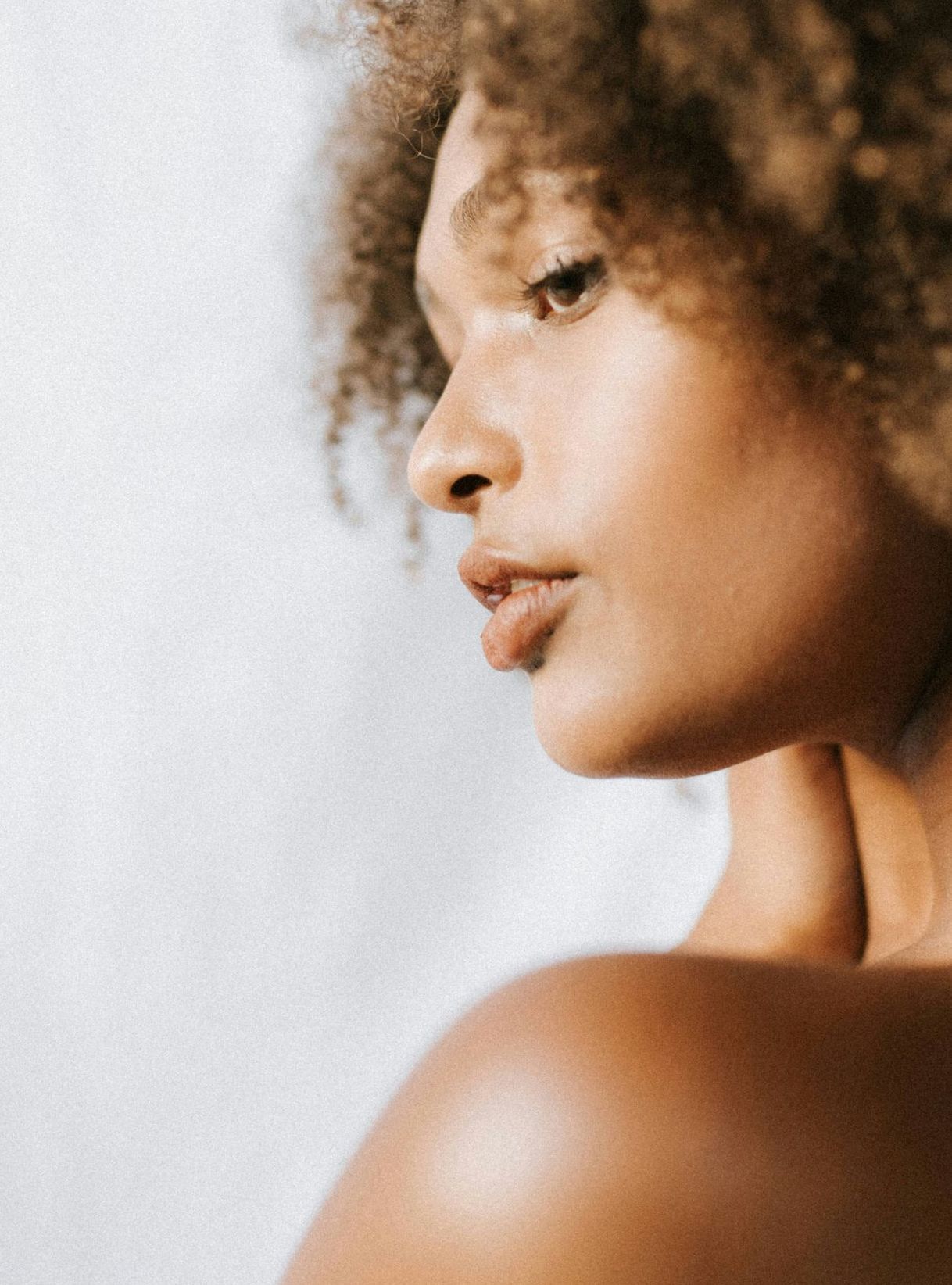 man looking in a mirror and smiling