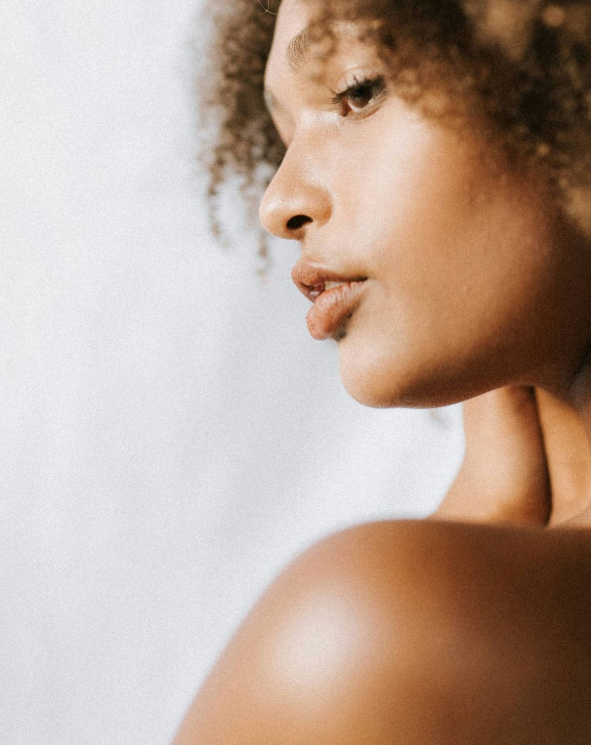 man looking in a mirror and smiling