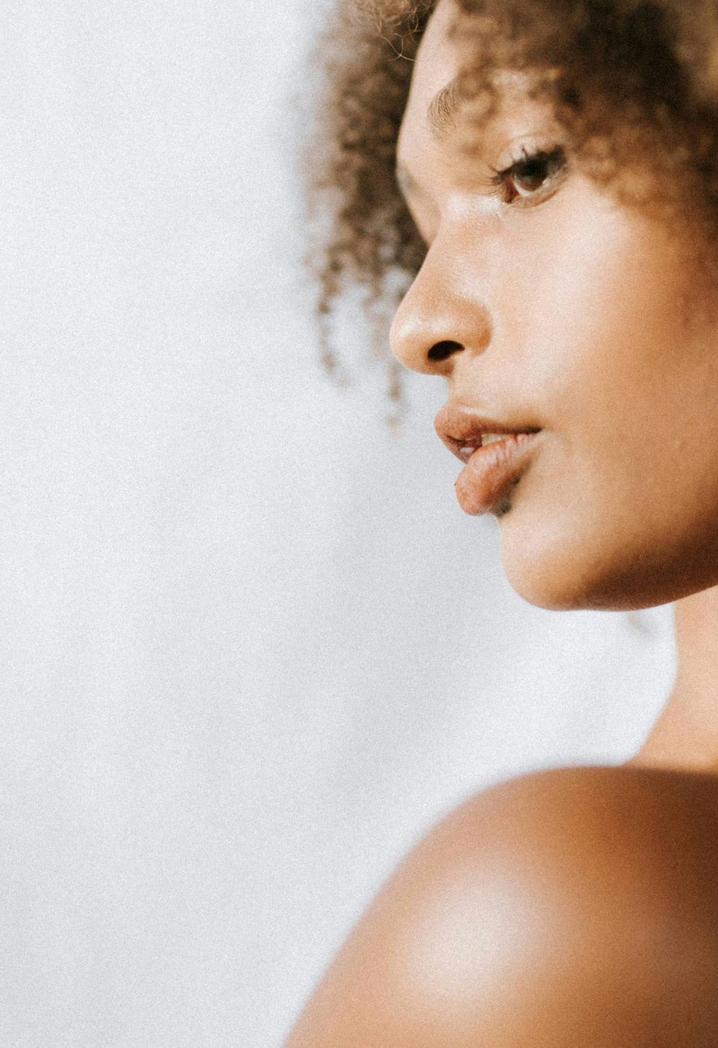 man looking in a mirror and smiling