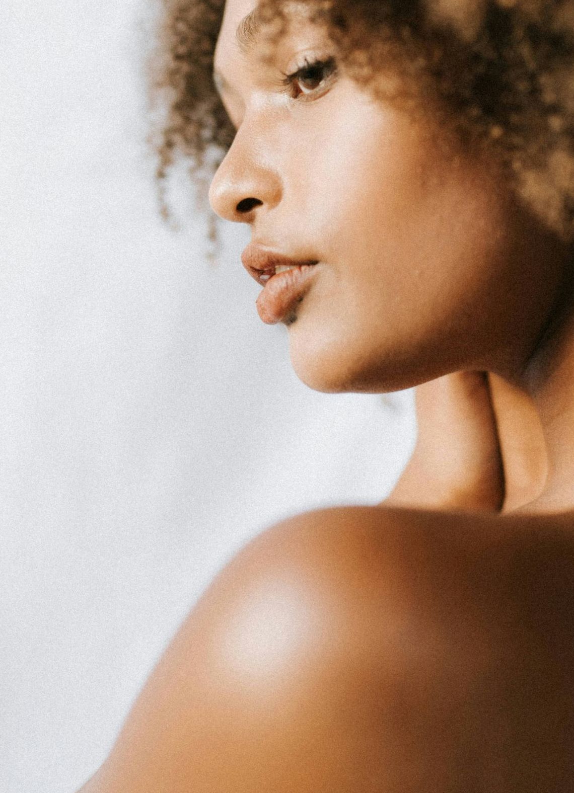 man looking in a mirror and smiling