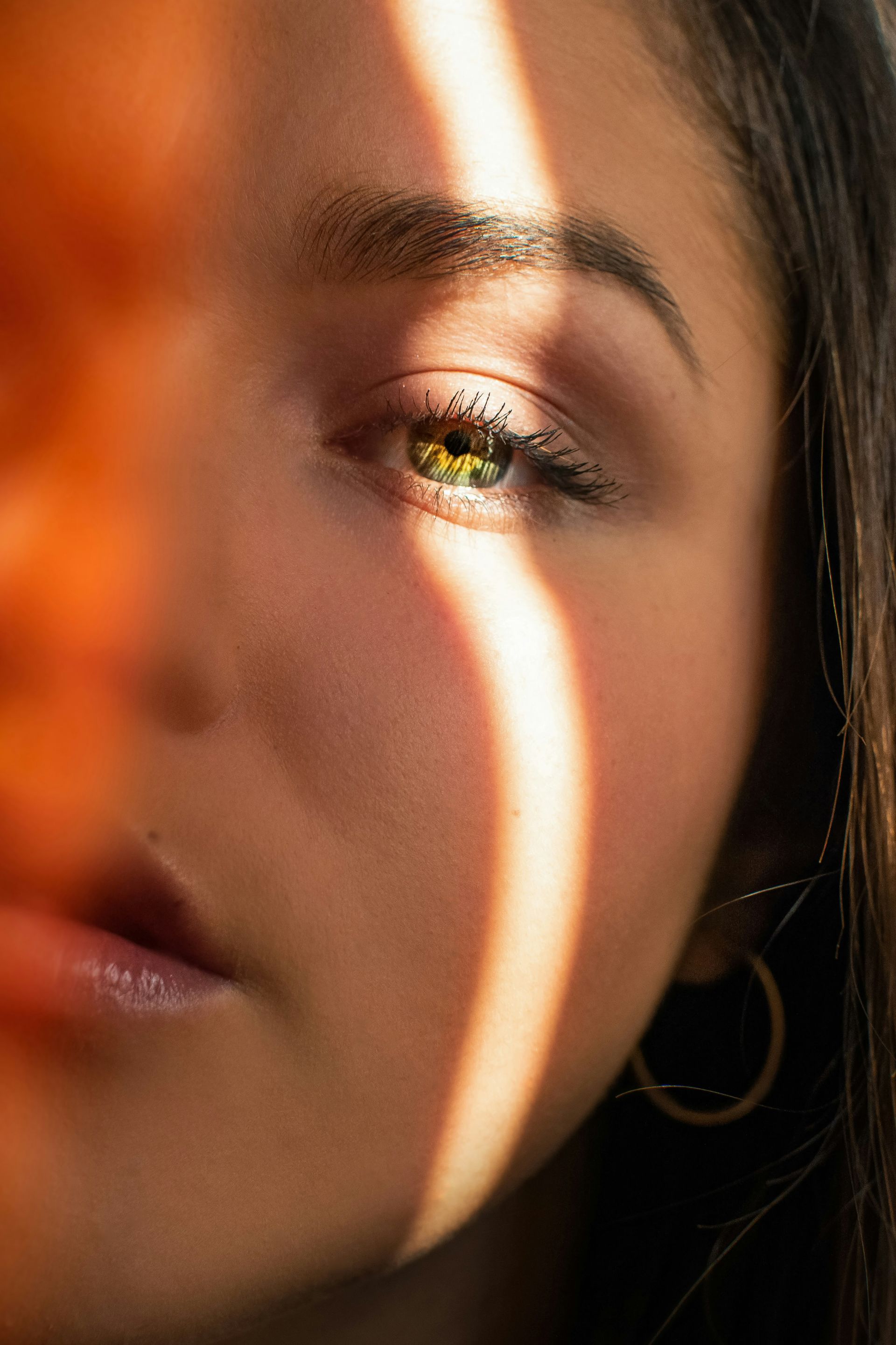 A woman is getting a laser treatment on her face.