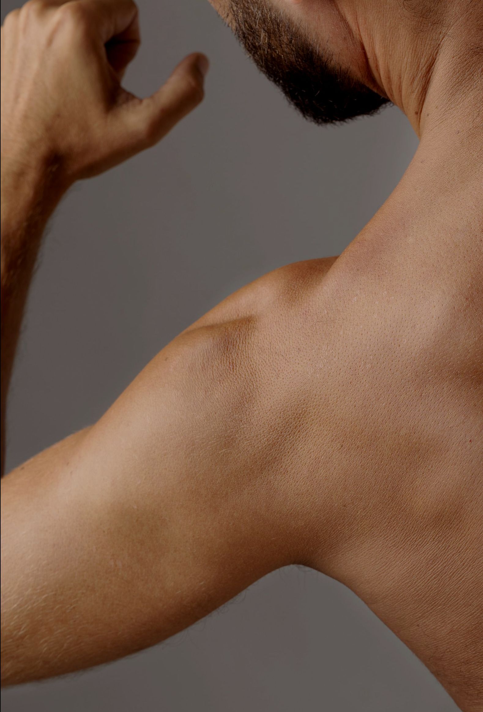 A doctor is giving an iv to a patient in a hospital bed.
